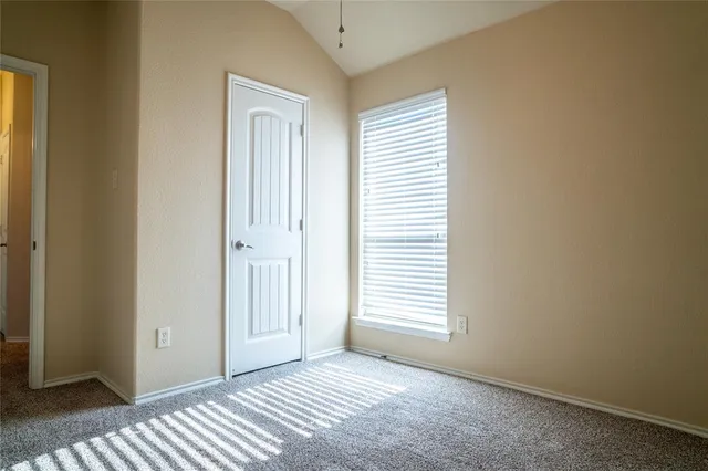 a view of a room that has a window in it