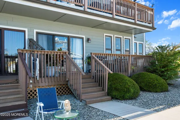 a view of a house with backyard and porch
