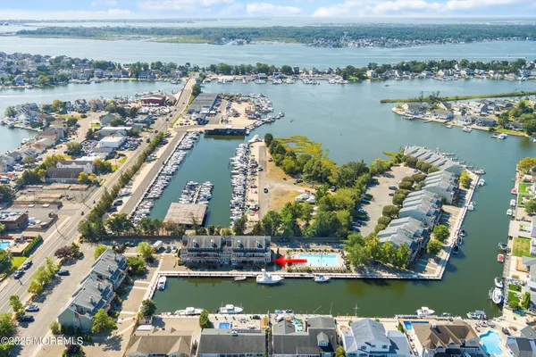 an aerial view of a city with a lake view