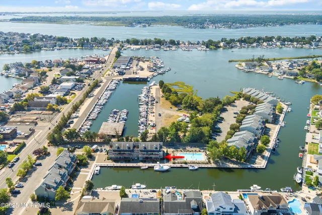 an aerial view of a city with a lake view