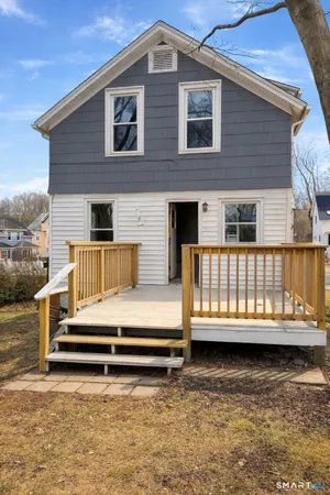 a backyard of a house with a deck