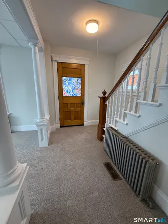 a view of livingroom with stairs and furniture