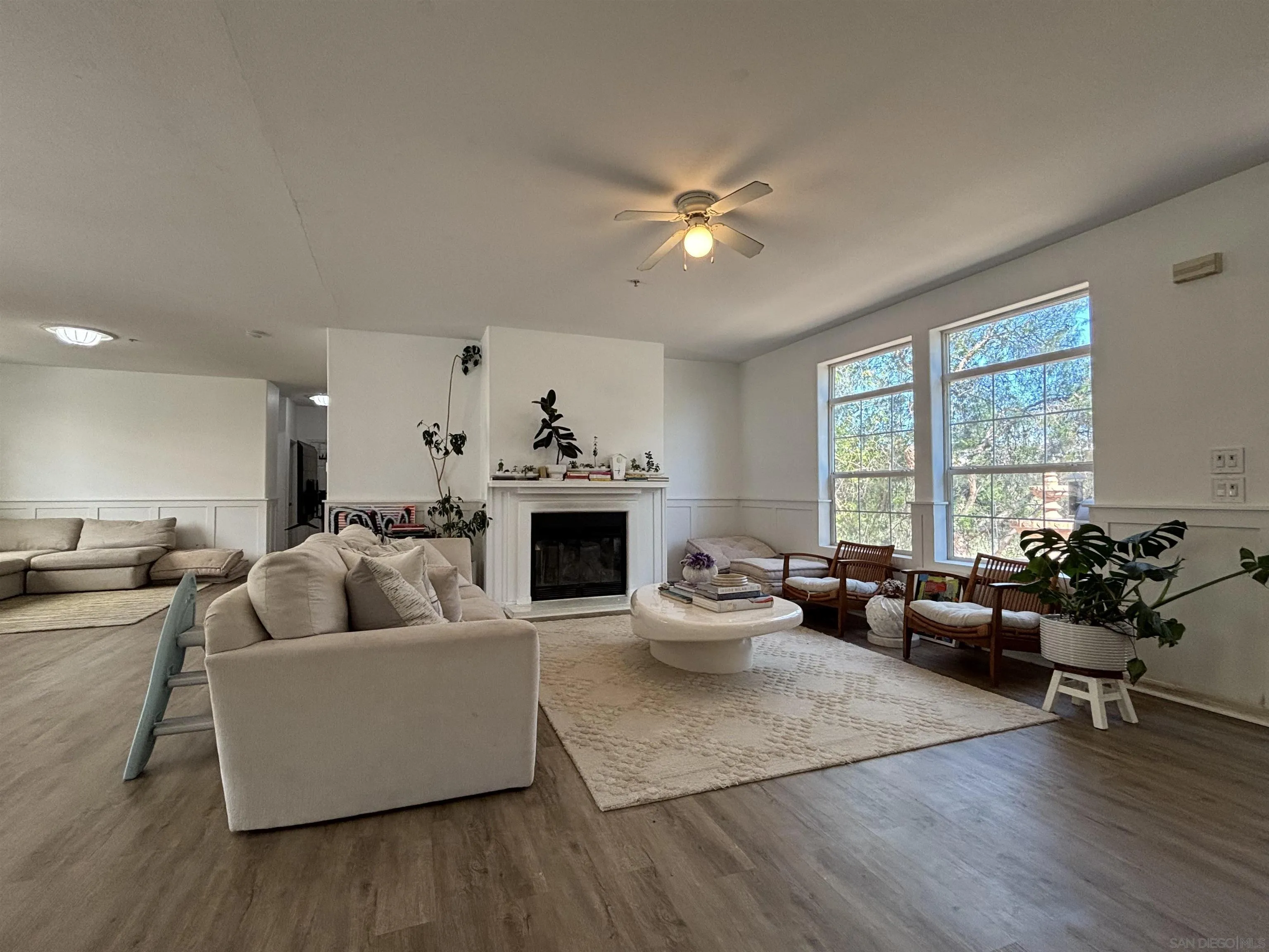 6960 West Lilac Road Bonsall, CA 92003 - Photo 12 of 37 a living room with furniture and a large window