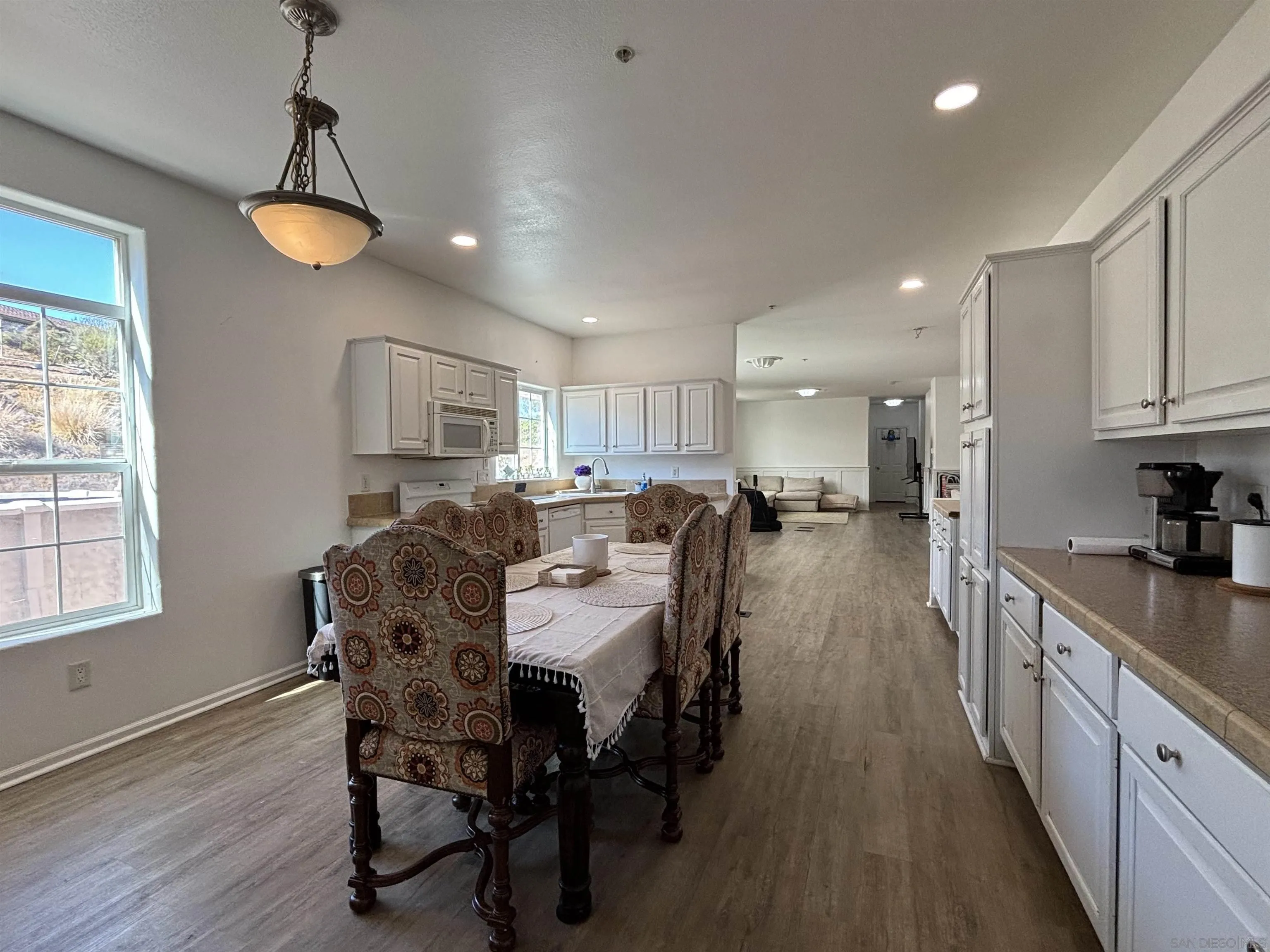 6960 West Lilac Road Bonsall, CA 92003 - Photo 15 of 37 a view of a dining room with furniture