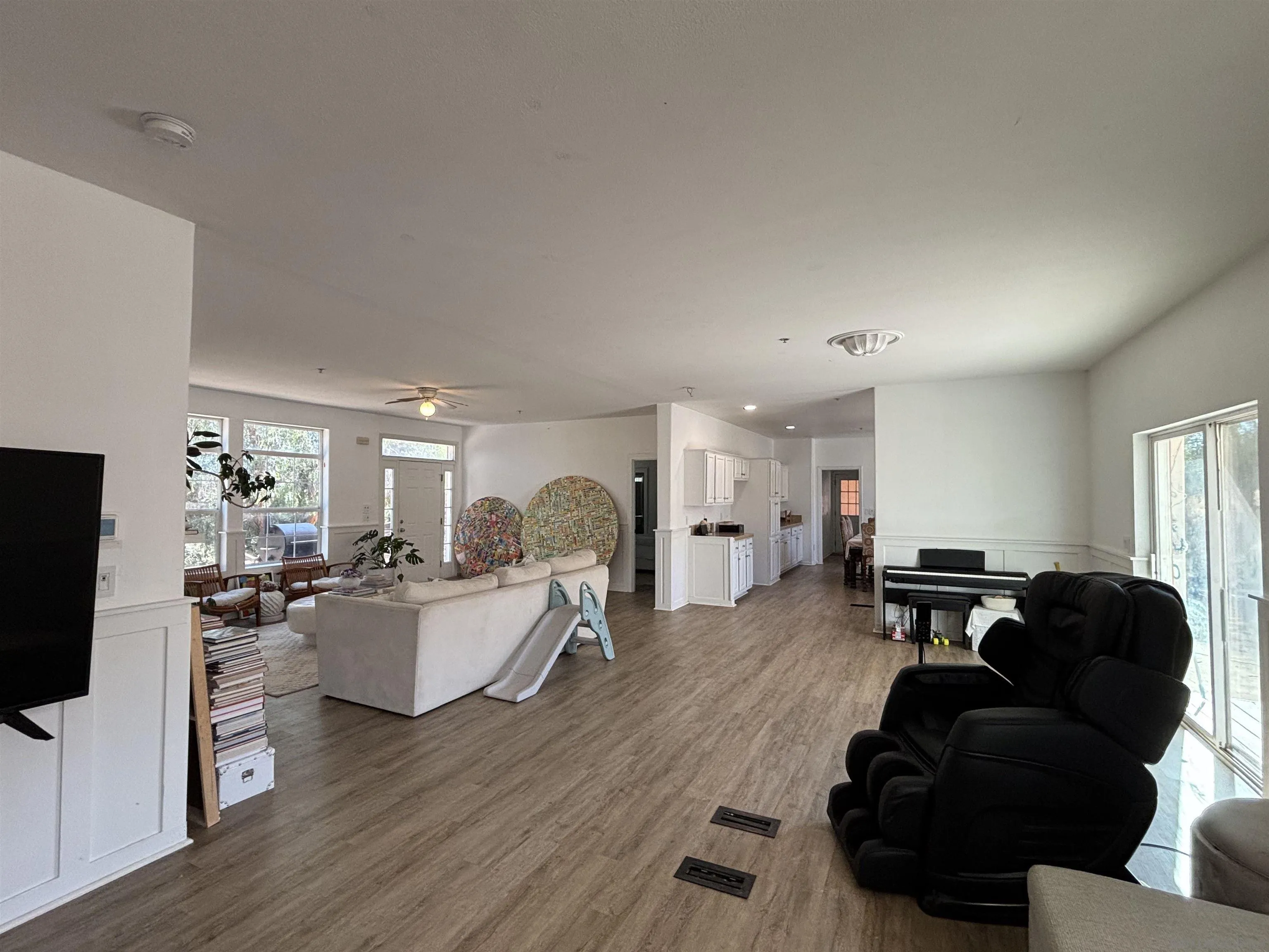 6960 West Lilac Road Bonsall, CA 92003 - Photo 16 of 37 a living room with fireplace furniture and a flat screen tv