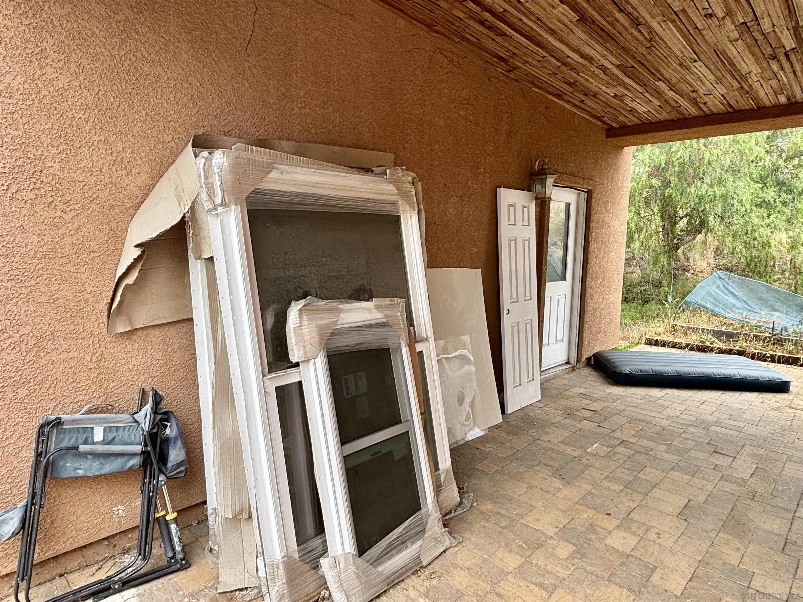 6960 West Lilac Road Bonsall, CA 92003 - Photo 30 of 37 a view of a storage and utility room with a window