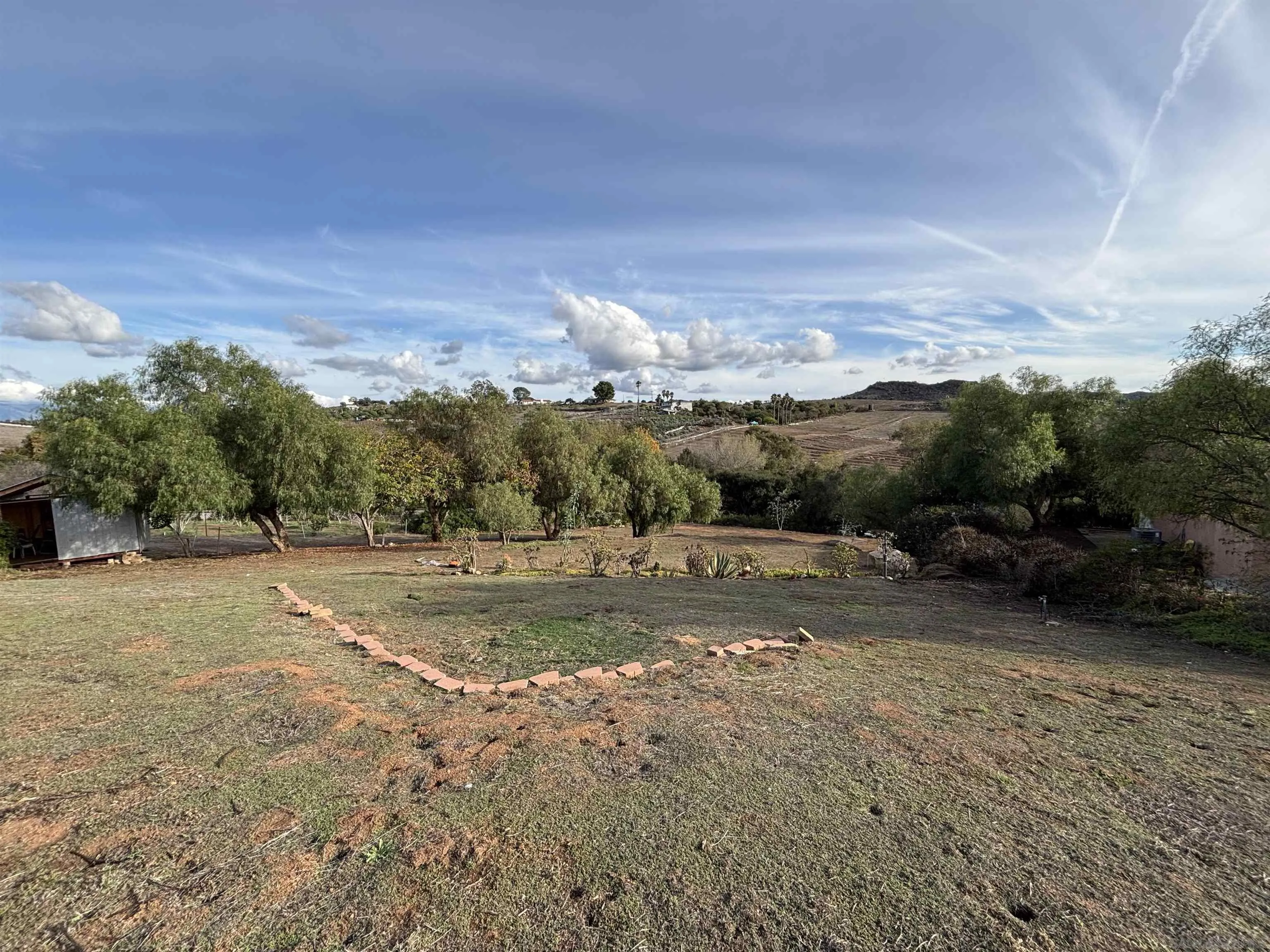 6960 West Lilac Road Bonsall, CA 92003 - Photo 8 of 37 a view of a town with big trees