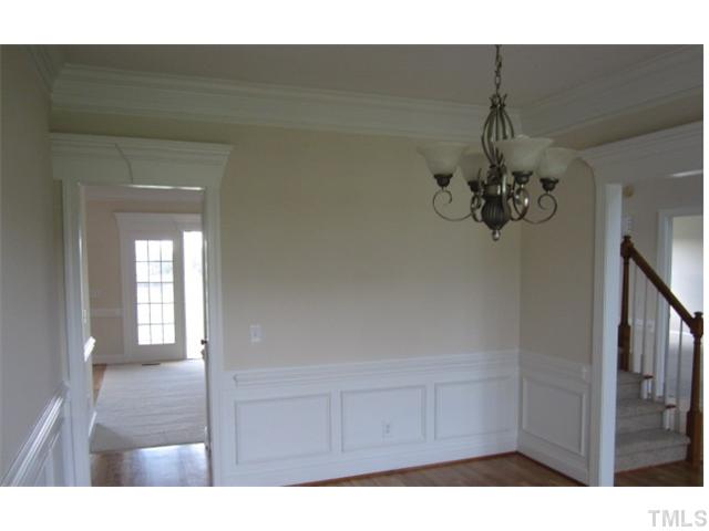 95 Steve Ridge Willow Spring, NC 27592 - Photo 8 of 10 a view of a hallway with a chandelier