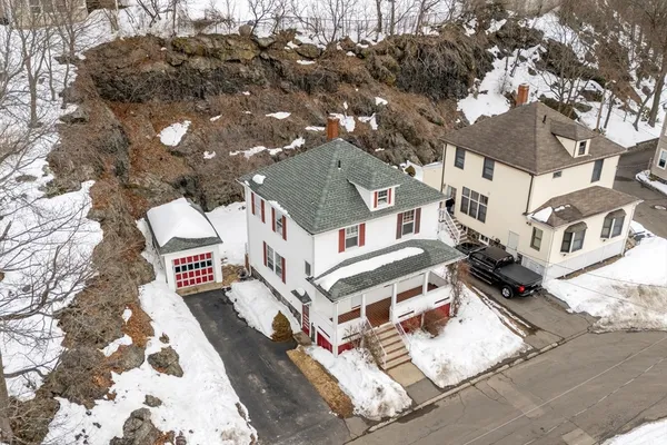a white building with a clock on the top