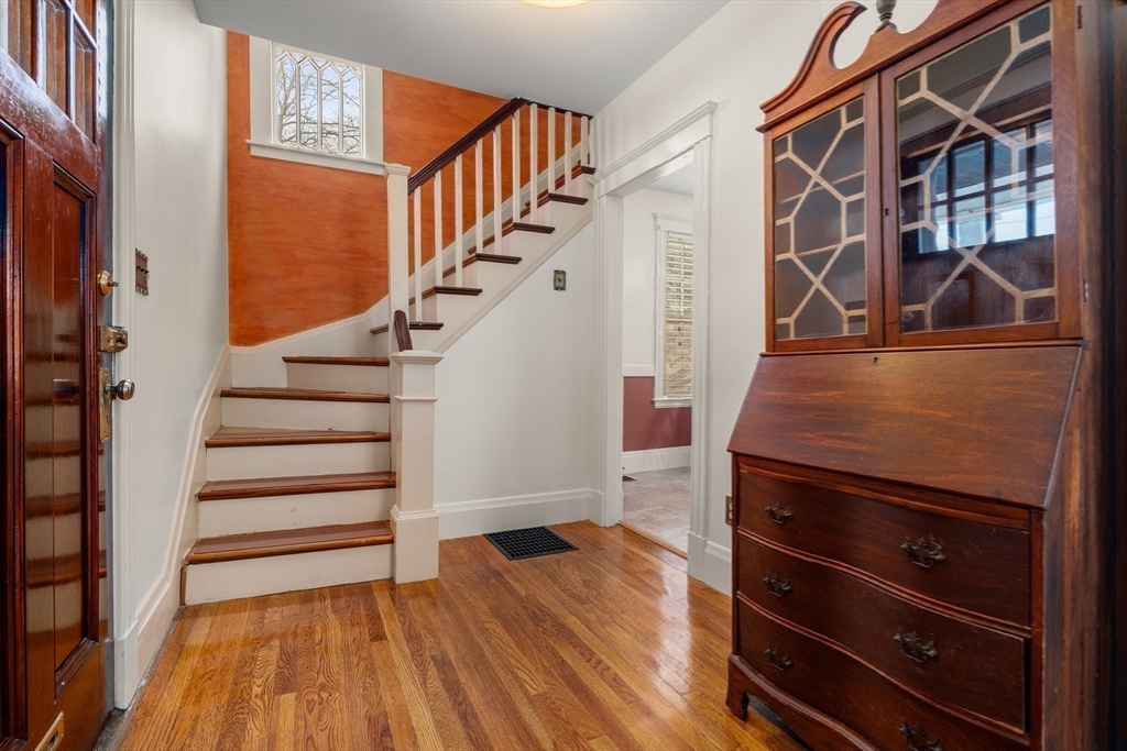 16 Isabella Street Lynn, MA 01902 - Photo 16 of 26 a view of entryway and hall with wooden floor