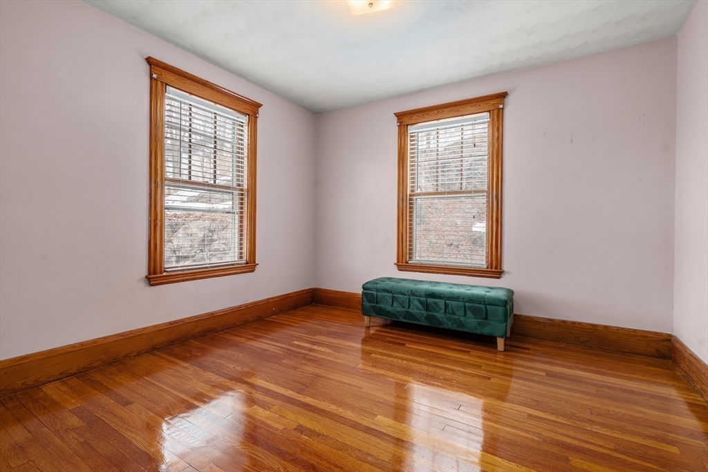 16 Isabella Street Lynn, MA 01902 - Photo 17 of 26 a bedroom with a bed and a window