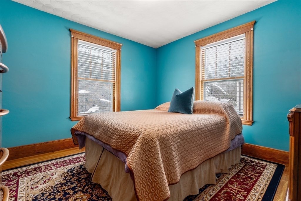 16 Isabella Street Lynn, MA 01902 - Photo 20 of 26 a bedroom with a bed and window