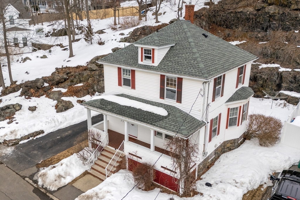 16 Isabella Street Lynn, MA 01902 - Photo 2 of 26 a aerial view of a house with a yard