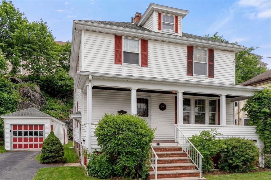 16 Isabella Street Lynn, MA 01902 - Photo 24 of 26 a front view of a house with a yard