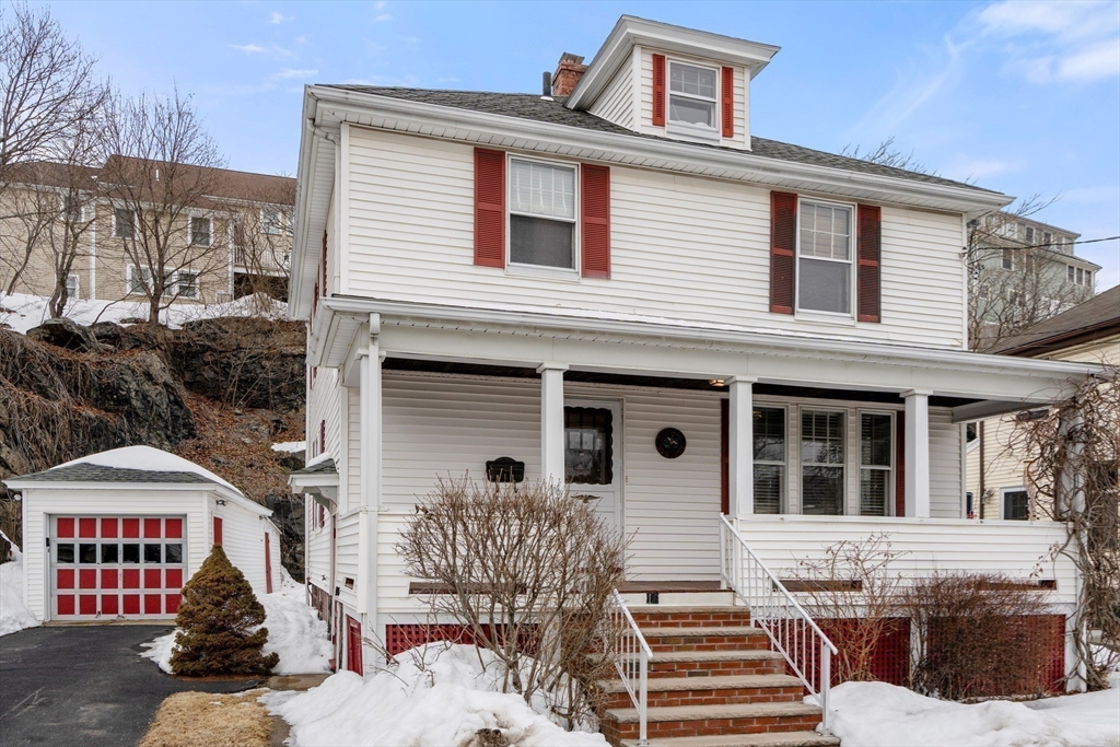 16 Isabella Street Lynn, MA 01902 - Photo 3 of 26 a front view of a house with a yard