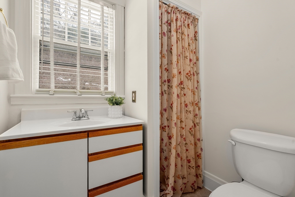 16 Isabella Street Lynn, MA 01902 - Photo 10 of 26 a bathroom with a sink toilet and shower