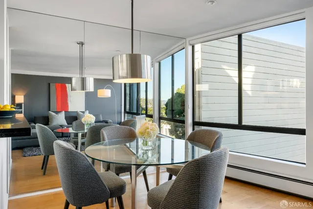 a dining room with furniture and window