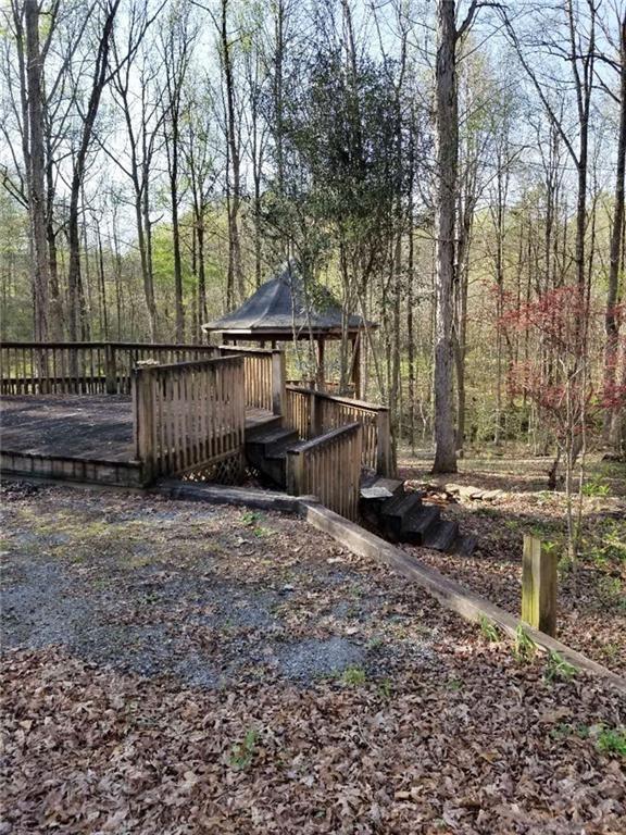 771 Lord Road Commerce, GA 30530 - Photo 12 of 16 a backyard of a house with lots of green space