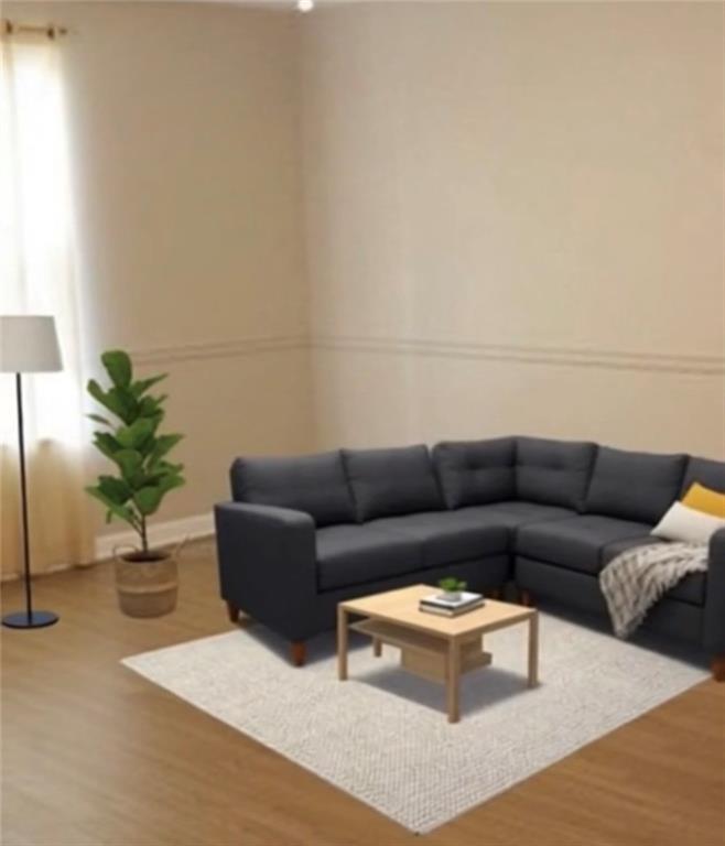 771 Lord Road Commerce, GA 30530 - Photo 6 of 16 a living room with furniture and a potted plant