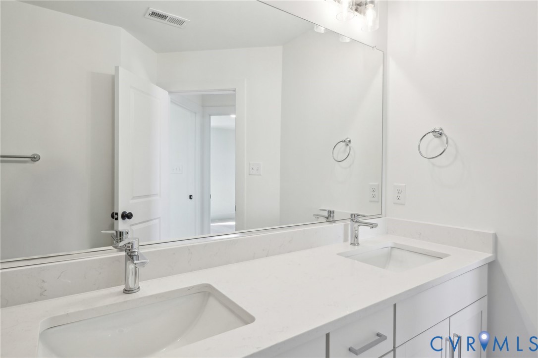 12002 Afternoon Path Henrico, VA 23233 - Photo 23 of 34 a bathroom with a sink and a mirror
