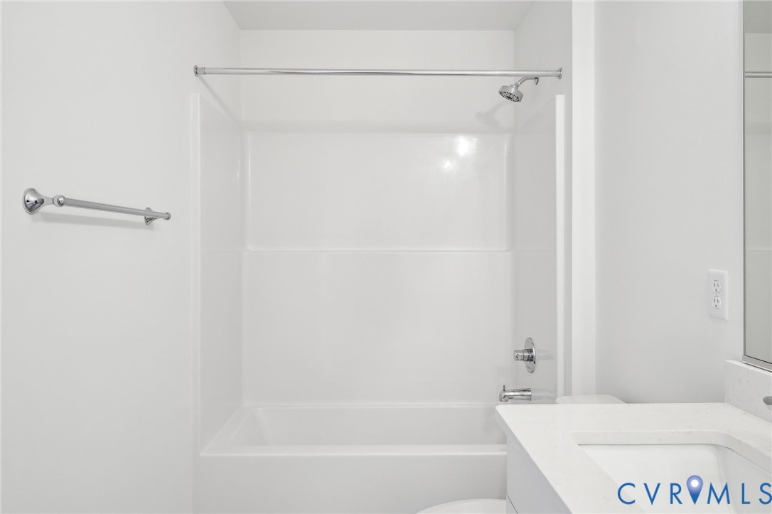 12002 Afternoon Path Henrico, VA 23233 - Photo 24 of 34 a bathroom with a bathtub and a shower