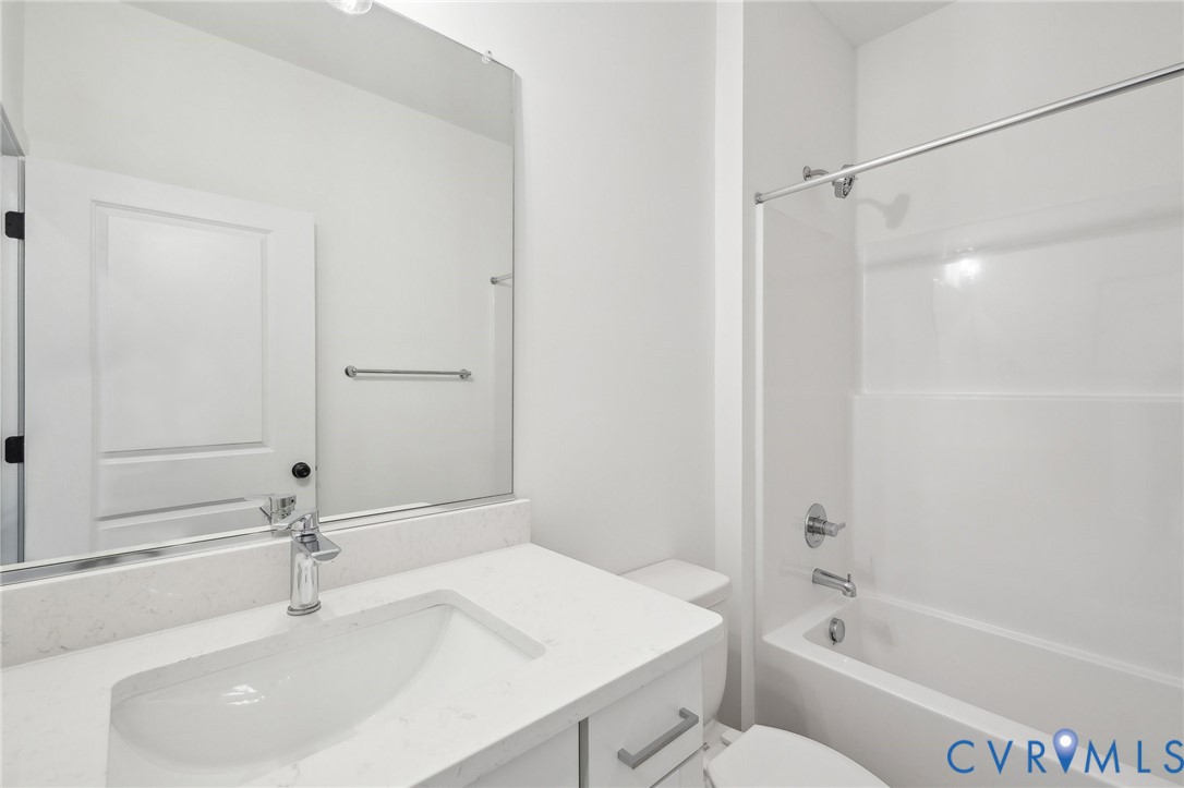 12002 Afternoon Path Henrico, VA 23233 - Photo 5 of 34 a bathroom with a bathtub and a sink