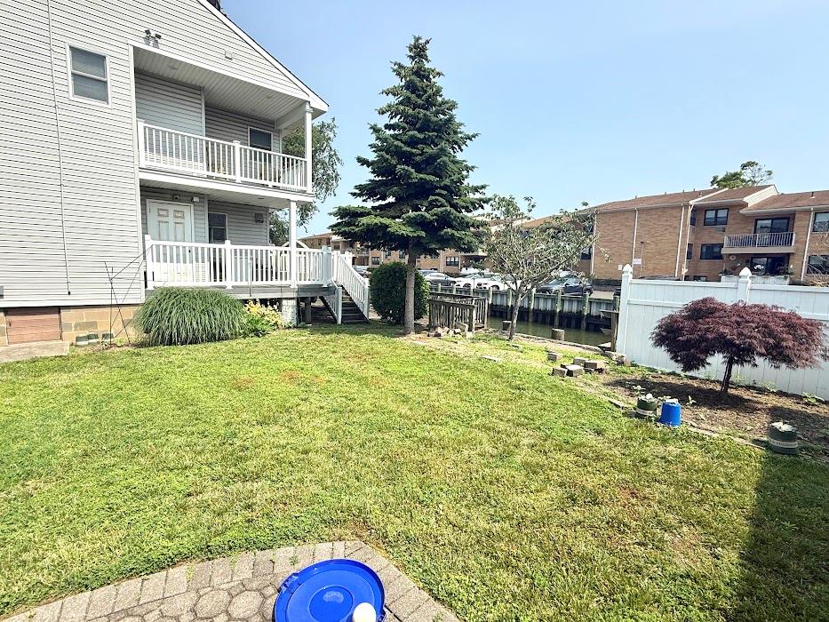 77 Hampton Place Freeport, NY 11520 - Photo 18 of 21 a house view with a garden space