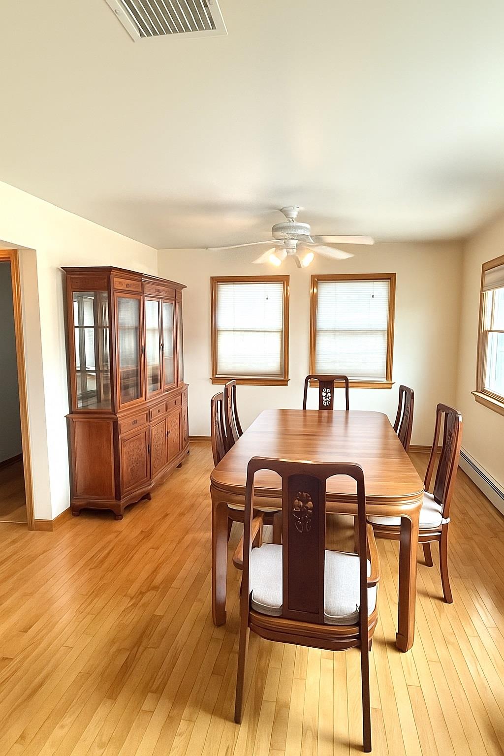 77 Hampton Place Freeport, NY 11520 - Photo 5 of 21 a view of a dining room with furniture and wooden floor