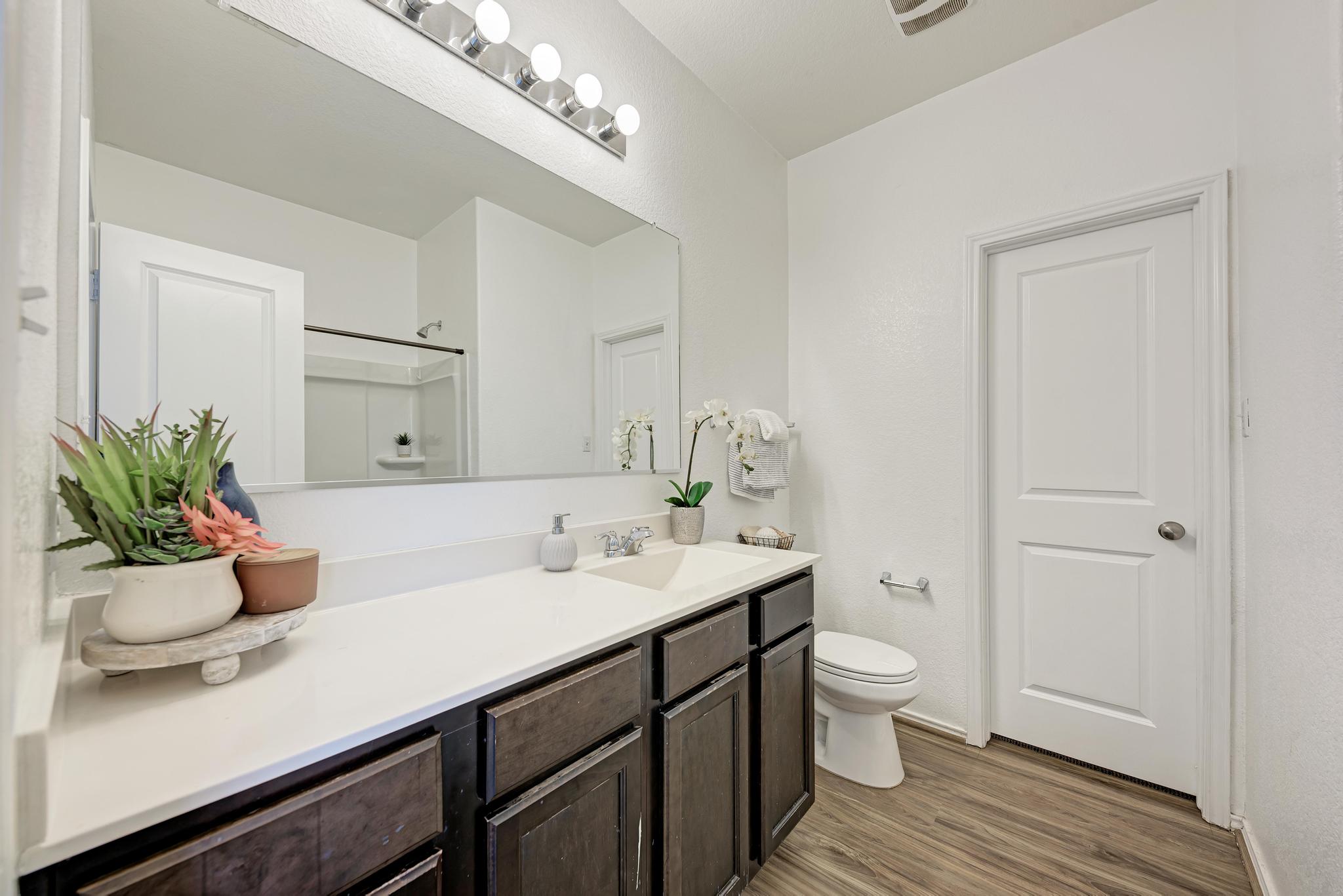 129 Vulcan Drive Jarrell, TX 76537 - Photo 20 of 35 a bathroom with a sink a toilet and vanity