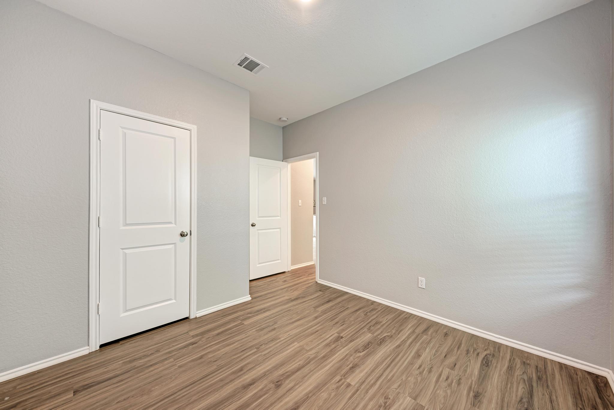 129 Vulcan Drive Jarrell, TX 76537 - Photo 24 of 35 a view of an empty room with wooden floor