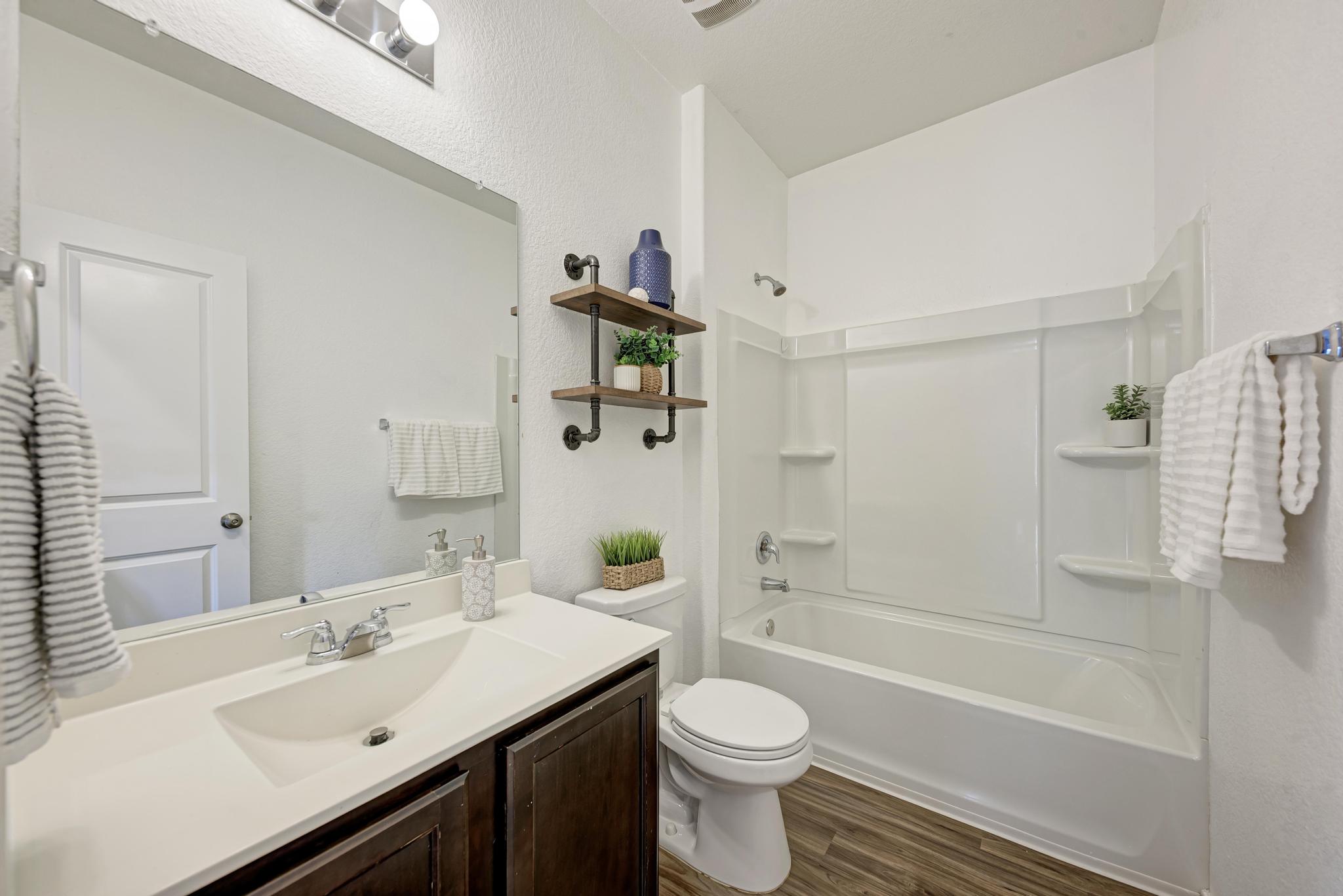 129 Vulcan Drive Jarrell, TX 76537 - Photo 25 of 35 a bathroom with a sink and a mirror