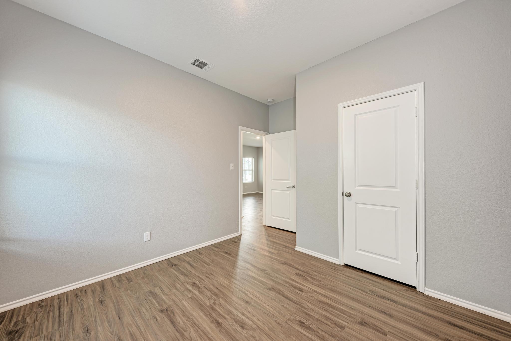 129 Vulcan Drive Jarrell, TX 76537 - Photo 27 of 35 a view of an empty room with wooden floor