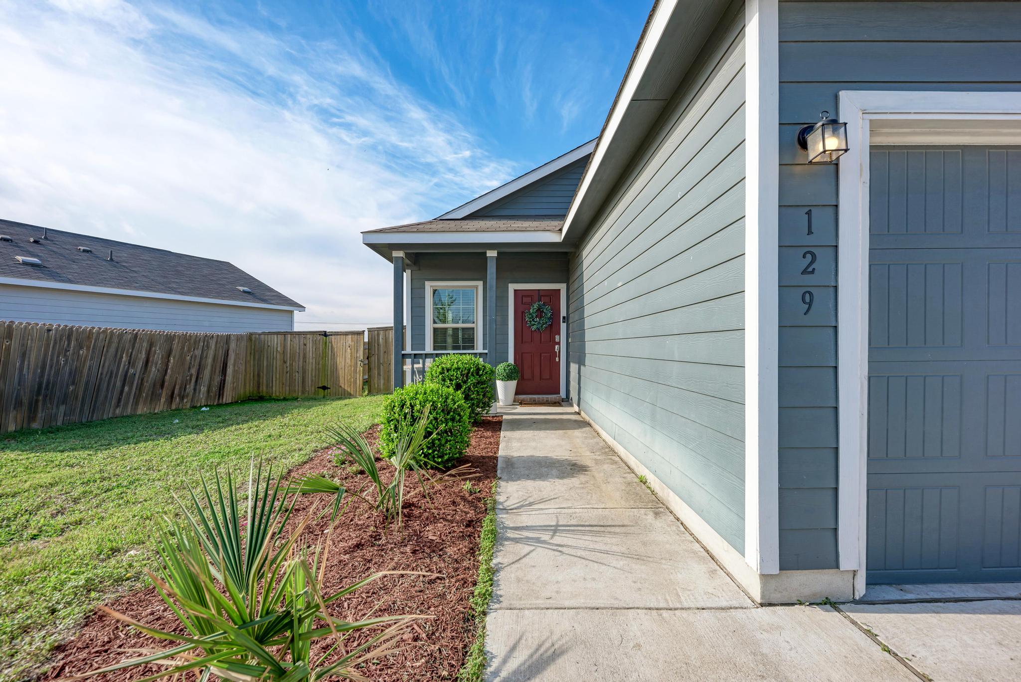 129 Vulcan Drive Jarrell, TX 76537 - Photo 5 of 35 a view of a backyard with plants
