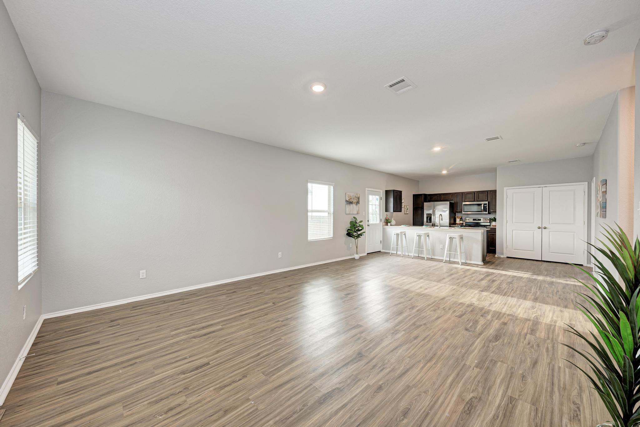 129 Vulcan Drive Jarrell, TX 76537 - Photo 7 of 35 a view of empty room with wooden floor and window