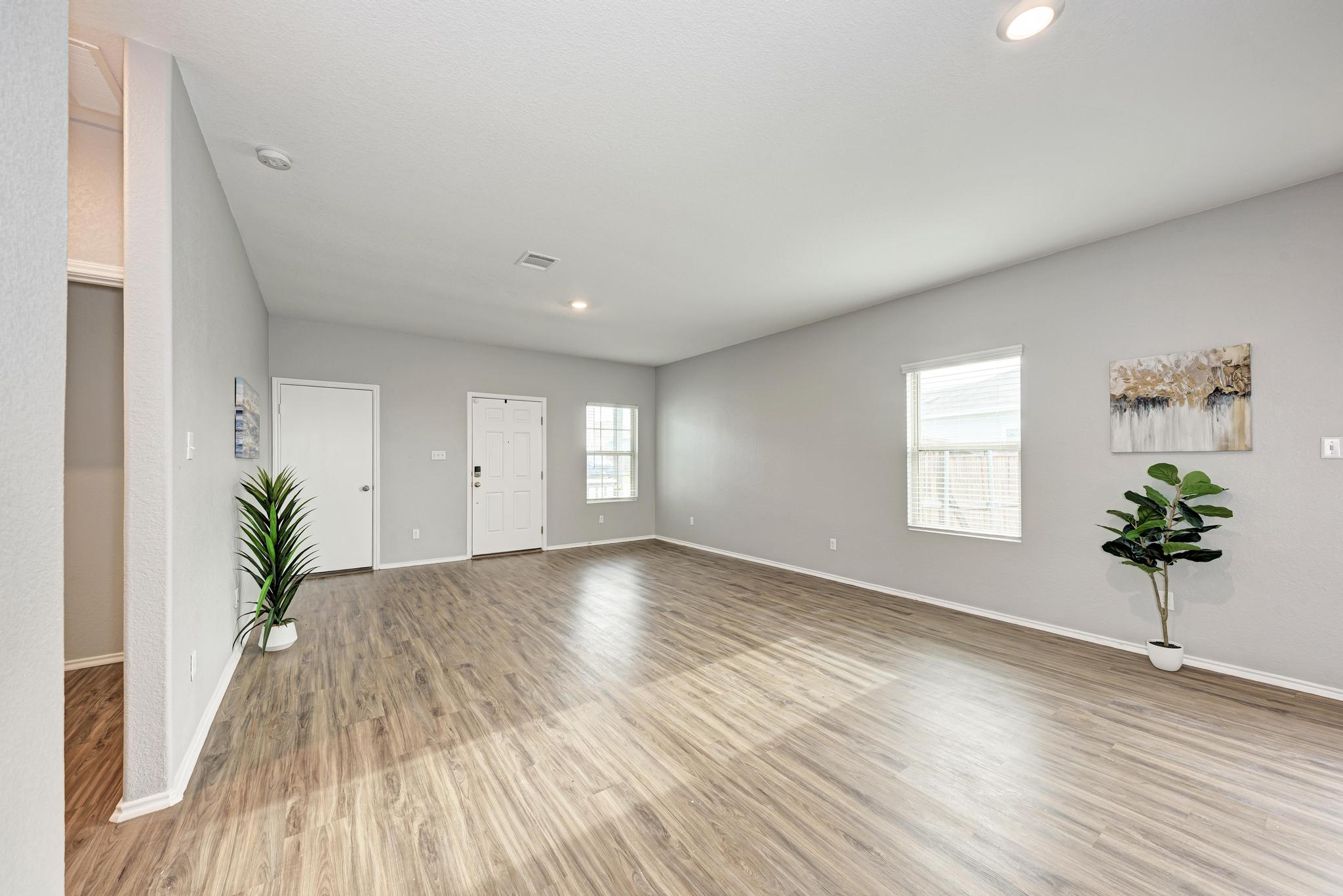 129 Vulcan Drive Jarrell, TX 76537 - Photo 10 of 35 a view of a room with wooden floor and plant