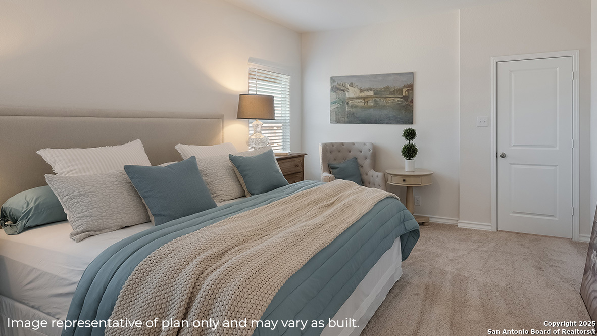 643 Fluted Shoals Cibolo, TX 78108 - Photo 11 of 27 a bedroom with a bed and a painting on the wall