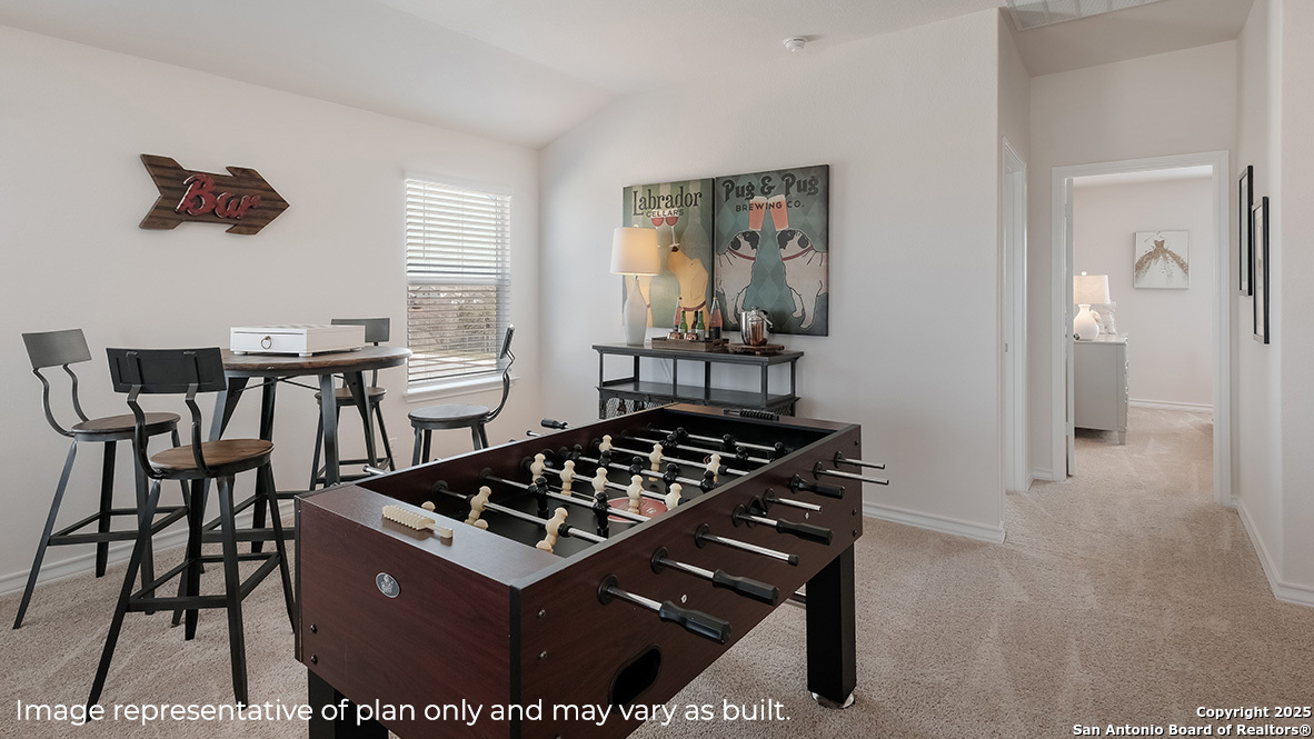 643 Fluted Shoals Cibolo, TX 78108 - Photo 15 of 27 a kitchen with a stove and a dining table