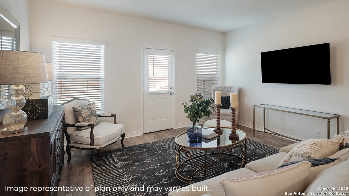 643 Fluted Shoals Cibolo, TX 78108 - Photo 7 of 27 a living room with furniture a flat screen tv and a large window