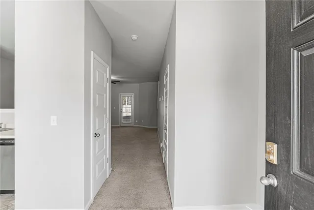 a view of a hallway with toilet