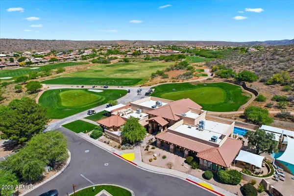 an aerial view of a house with a garden
