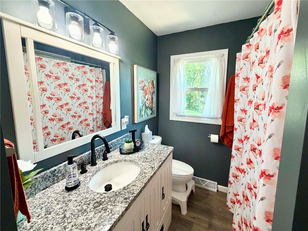 1108 South 3rd Street Effingham, IL 62401 - Photo 13 of 29 a bathroom with a sink toilet and shower
