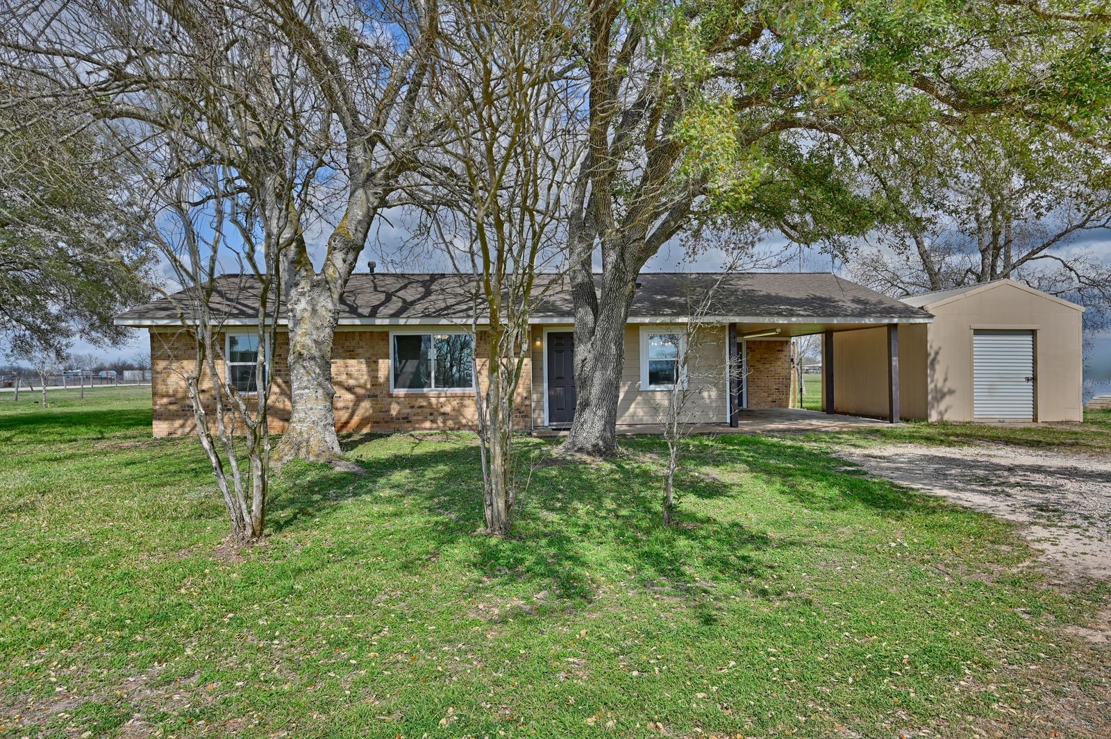 3249 Newsom Road Bellville, TX 77418 - Photo 1 of 20 front view of house with a yard