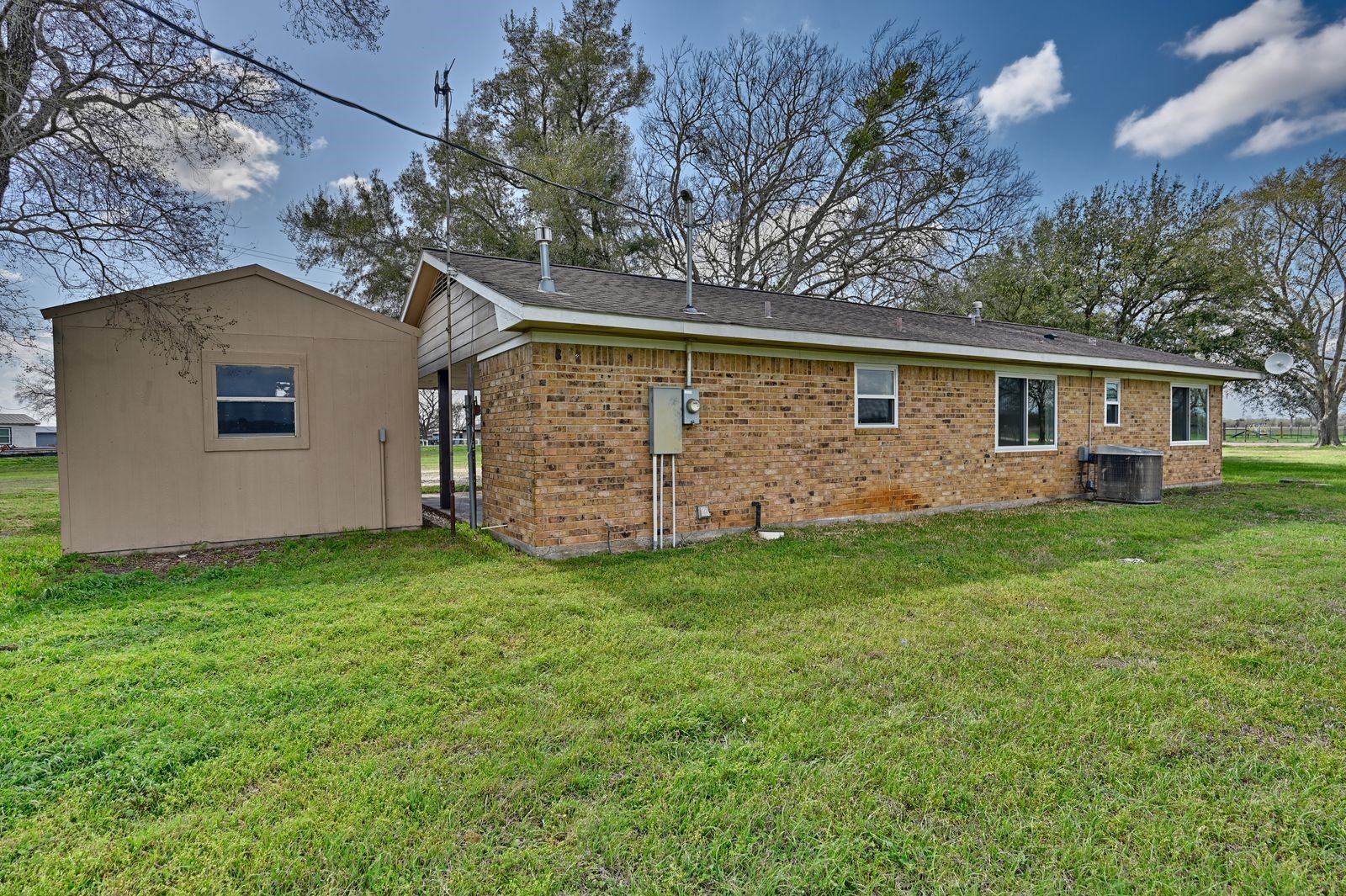 3249 Newsom Road Bellville, TX 77418 - Photo 15 of 20 a front view of house with yard and trees
