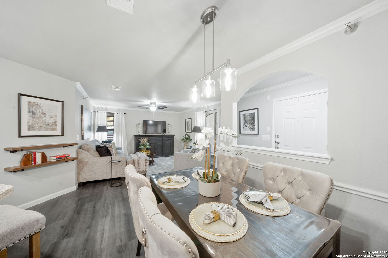 7323 Snowden Road, Unit 2201 San Antonio, TX 78229 - Photo 17 of 27 a living room with furniture kitchen view and a wooden floor