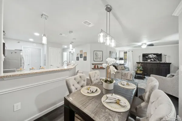 a view of a dining room and livingroom with furniture