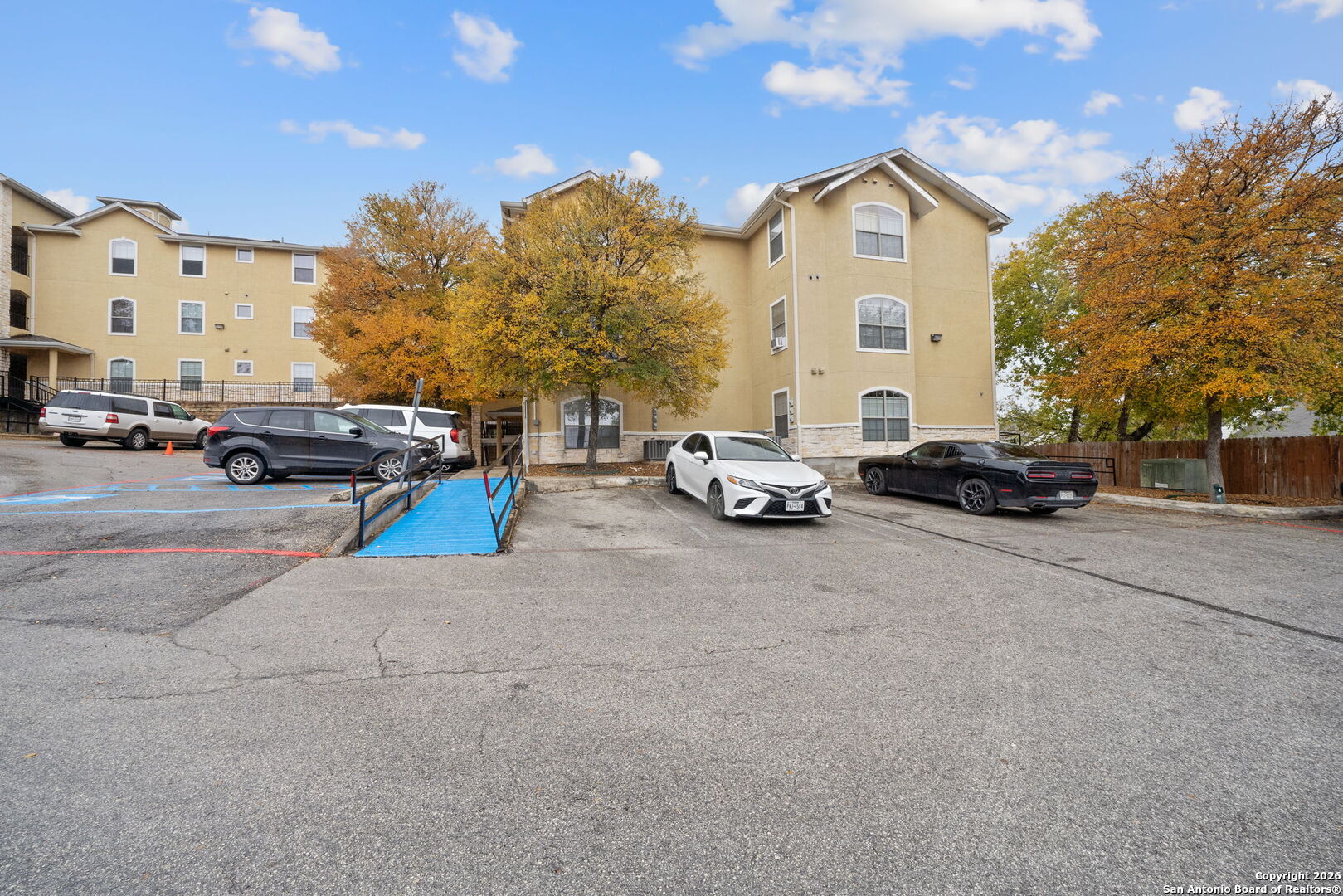 7323 Snowden Road, Unit 2201 San Antonio, TX 78229 - Photo 2 of 27 a car parked in front of a building
