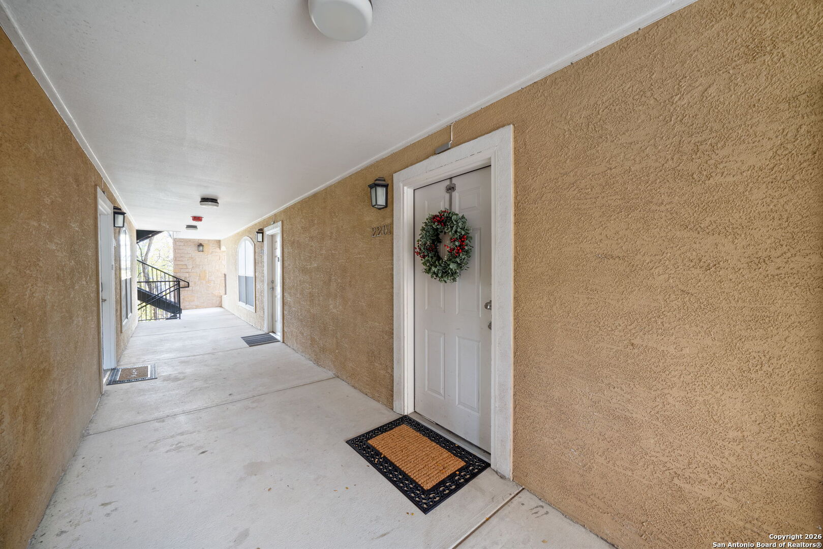 7323 Snowden Road, Unit 2201 San Antonio, TX 78229 - Photo 4 of 27 a view of a hallway with a elevator