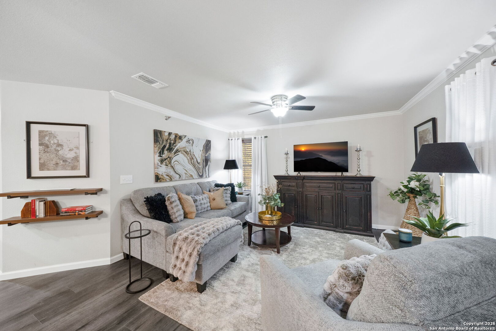 7323 Snowden Road, Unit 2201 San Antonio, TX 78229 - Photo 6 of 27 a living room with furniture and a flat screen tv