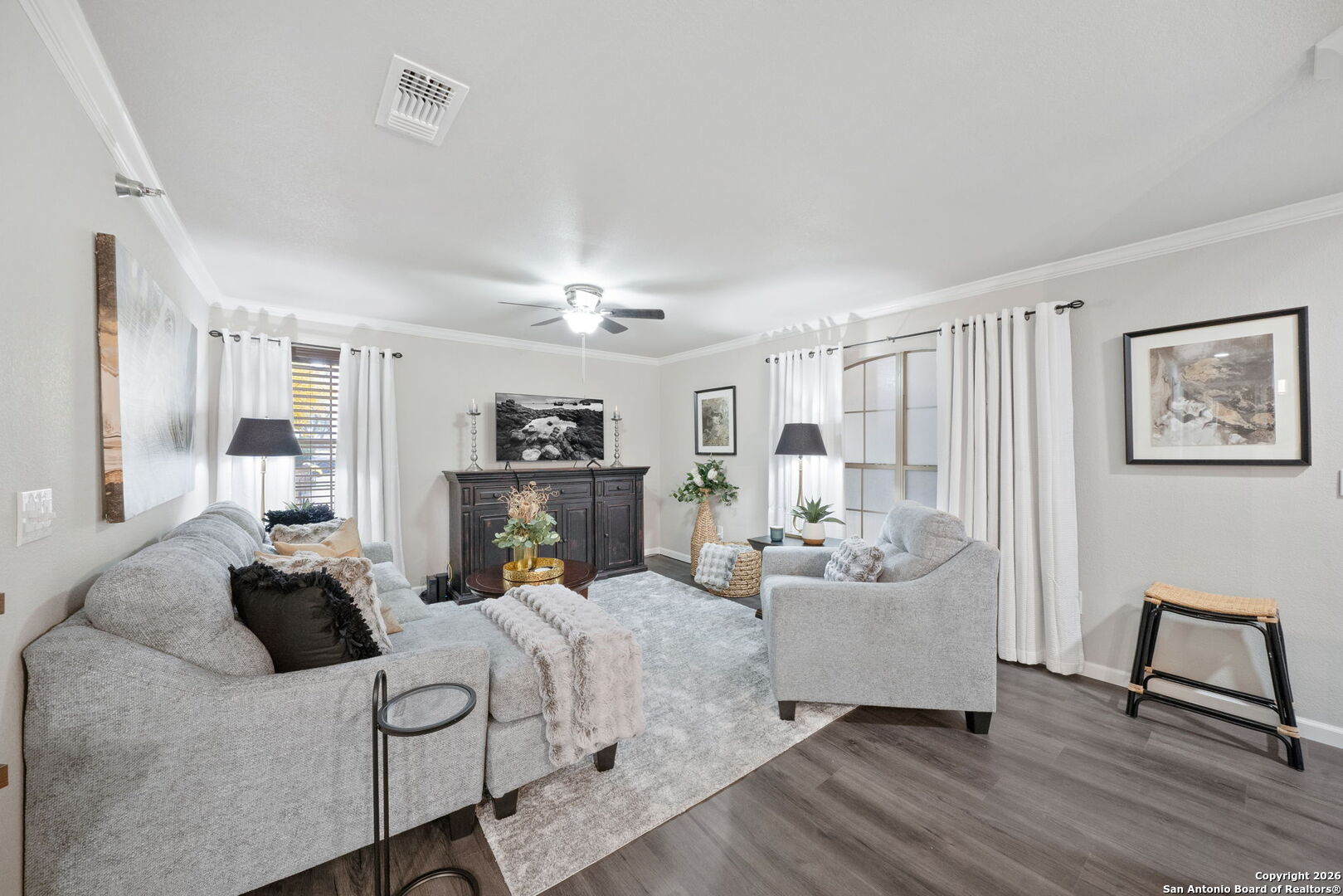 7323 Snowden Road, Unit 2201 San Antonio, TX 78229 - Photo 7 of 27 a living room with furniture and a chandelier