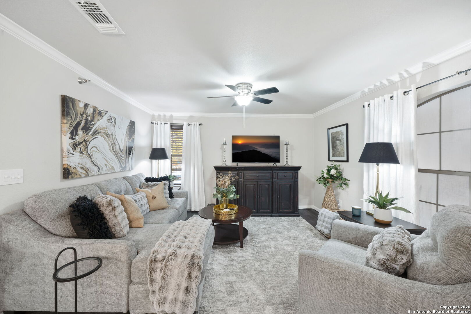 7323 Snowden Road, Unit 2201 San Antonio, TX 78229 - Photo 9 of 27 a living room with furniture and a flat screen tv